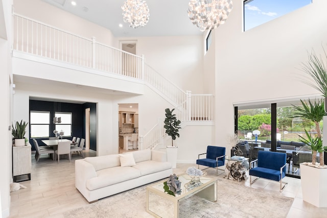 8640 E Baypoint Cir, Parkland, FL 33076 - living room with a high ceiling, a chandelier, stairway, and recessed lighting