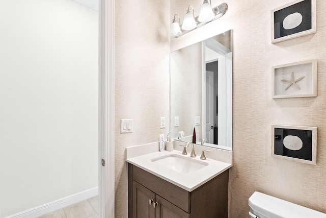 8640 E Baypoint Cir, Parkland, FL 33076 - bathroom with toilet, vanity, and baseboards