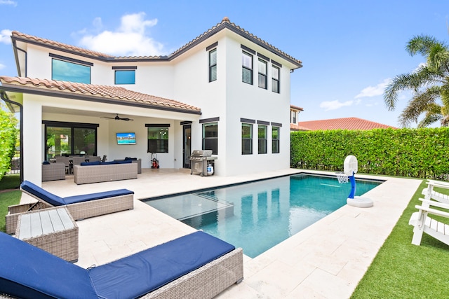 8640 E Baypoint Cir, Parkland, FL 33076 - back of house with an outdoor hangout area, ceiling fan, a tiled roof, stucco siding, and a patio area