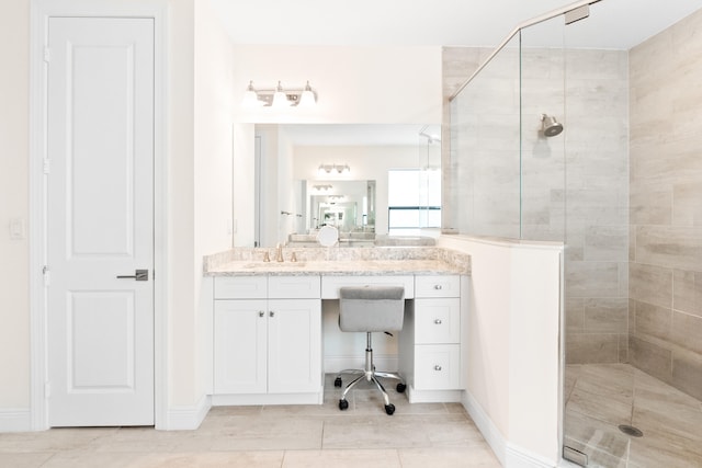 8640 E Baypoint Cir, Parkland, FL 33076 - full bathroom featuring a tile shower, vanity, tile patterned flooring, and baseboards