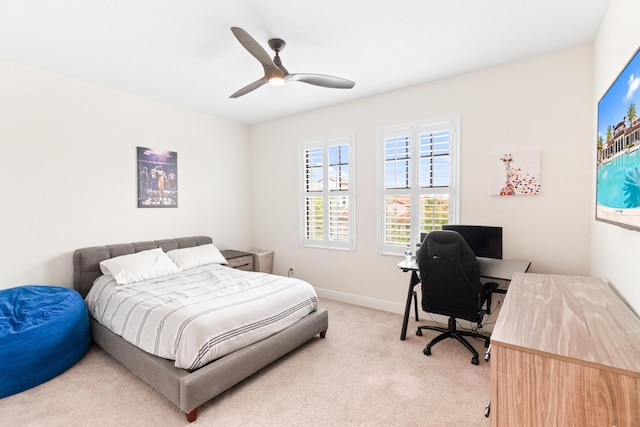 8640 E Baypoint Cir, Parkland, FL 33076 - bedroom with light carpet, a desk, ceiling fan, and baseboards