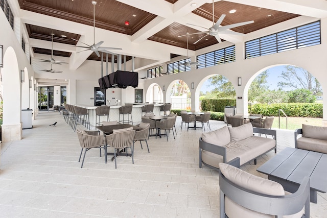 8640 E Baypoint Cir, Parkland, FL 33076 - view of patio featuring a ceiling fan, an outdoor hangout area, a bar, outdoor dining area, and a balcony