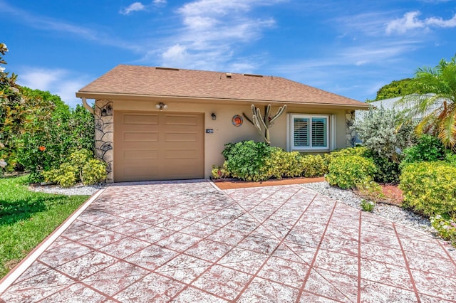 1420 NW 27th Ave, Delray Beach, FL 33445 - single story home with concrete driveway, a garage, and stucco siding