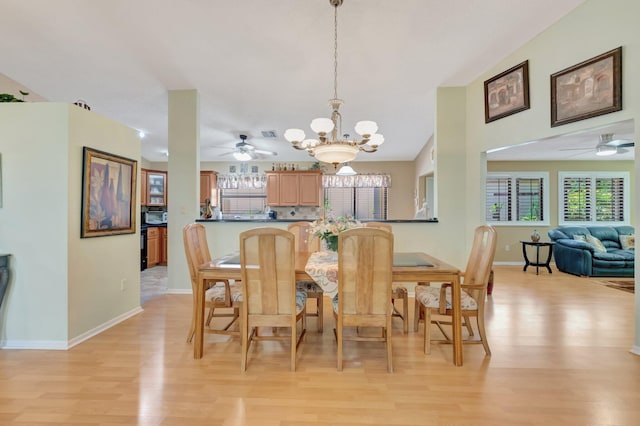 1420 NW 27th Ave, Delray Beach, FL 33445 - dining area featuring a chandelier, ceiling fan, light wood-type flooring, and baseboards