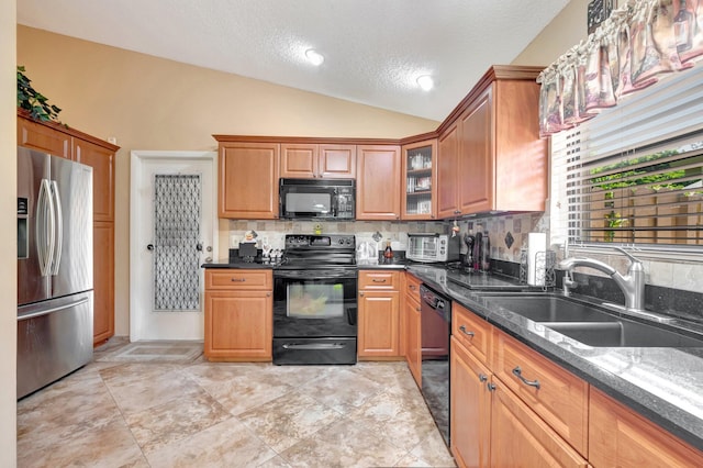 1420 NW 27th Ave, Delray Beach, FL 33445 - kitchen featuring black appliances, vaulted ceiling, a sink, tasteful backsplash, and a textured ceiling