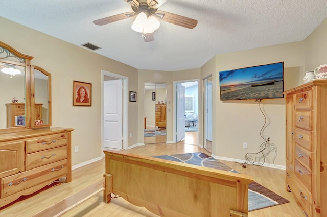 1420 NW 27th Ave, Delray Beach, FL 33445 - office space featuring light wood-style floors, a ceiling fan, a textured ceiling, and baseboards