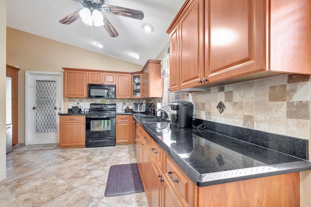 1420 NW 27th Ave, Delray Beach, FL 33445 - kitchen featuring black appliances, a sink, lofted ceiling, tasteful backsplash, and a ceiling fan