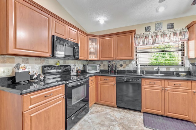 1420 NW 27th Ave, Delray Beach, FL 33445 - kitchen with black appliances, a sink, tasteful backsplash, vaulted ceiling, and a textured ceiling