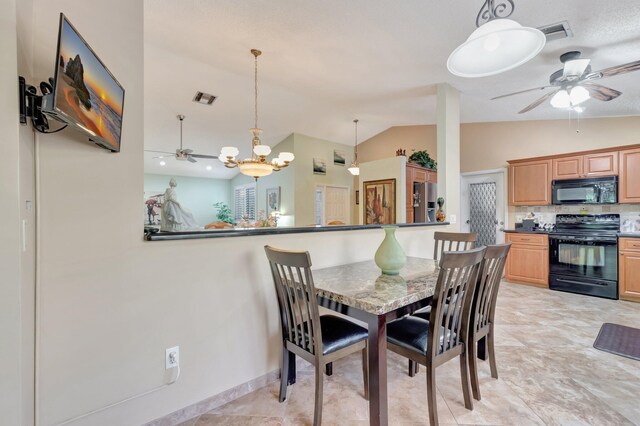 1420 NW 27th Ave, Delray Beach, FL 33445 - dining room featuring a ceiling fan and lofted ceiling