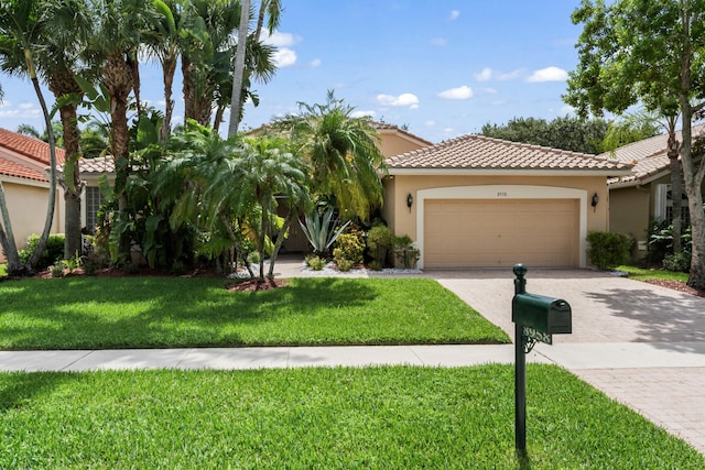 8958 Terni Ln, Boynton Beach, FL 33472 - view of front of property with decorative driveway, a tiled roof, a garage, and stucco siding