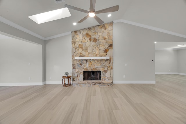 unfurnished living room featuring wood finished floors, a ceiling fan, a fireplace, ornamental molding, and vaulted ceiling
