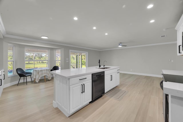 kitchen featuring black dishwasher, light wood finished floors, crown molding, recessed lighting, and light countertops