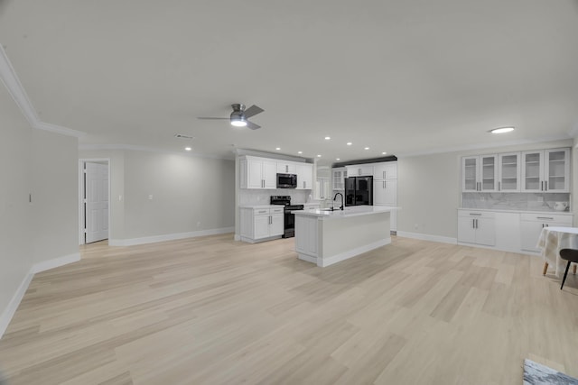 unfurnished living room featuring ornamental molding, ceiling fan, baseboards, light wood-style flooring, and recessed lighting