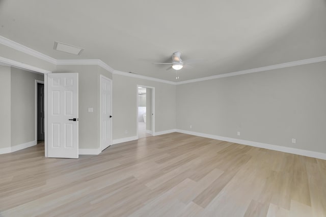 spare room with ceiling fan, light wood-style flooring, baseboards, and ornamental molding
