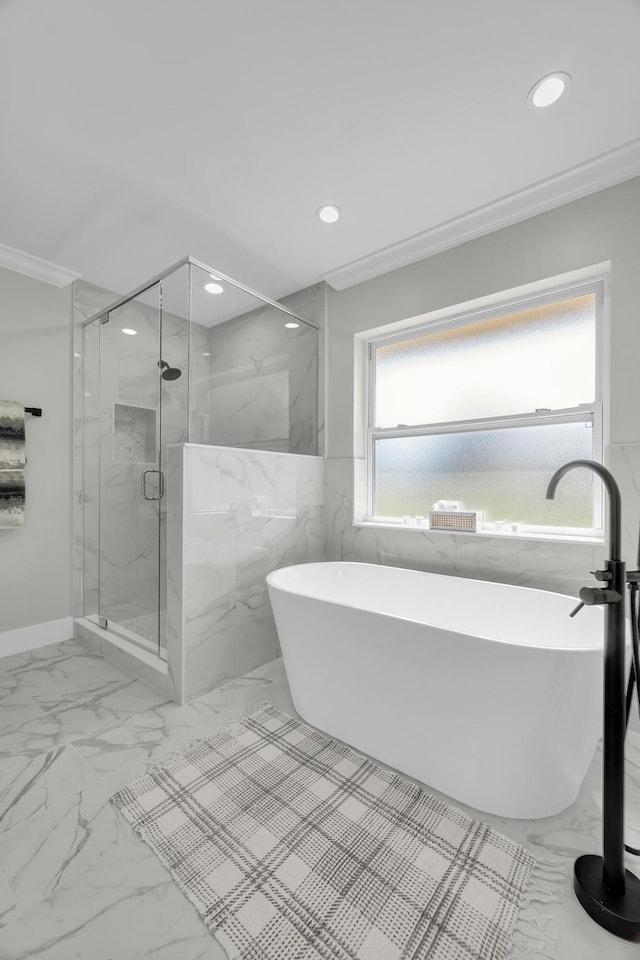 bathroom featuring marble finish floors, recessed lighting, a marble finish shower, a soaking tub, and tile walls