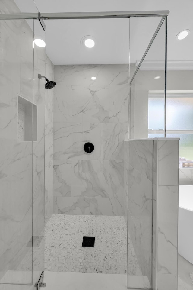 full bathroom with a marble finish shower and recessed lighting