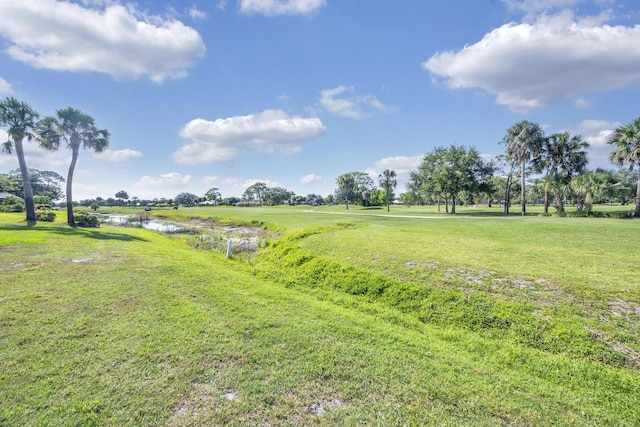 view of grassy yard with a water view
