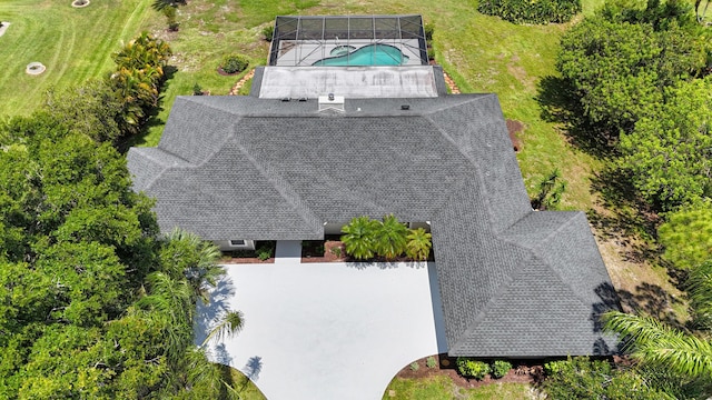 aerial view of property and surrounding area featuring a pool area