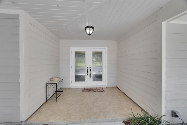 entrance to property with french doors and a patio area