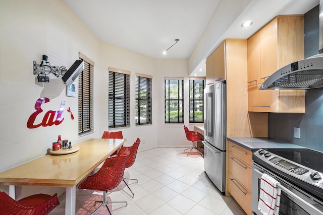 17652 Ashbourne D Way Unit D, Boca Raton, FL 33496 - kitchen with stainless steel appliances, wall chimney range hood, light tile patterned floors, tasteful backsplash, and baseboards
