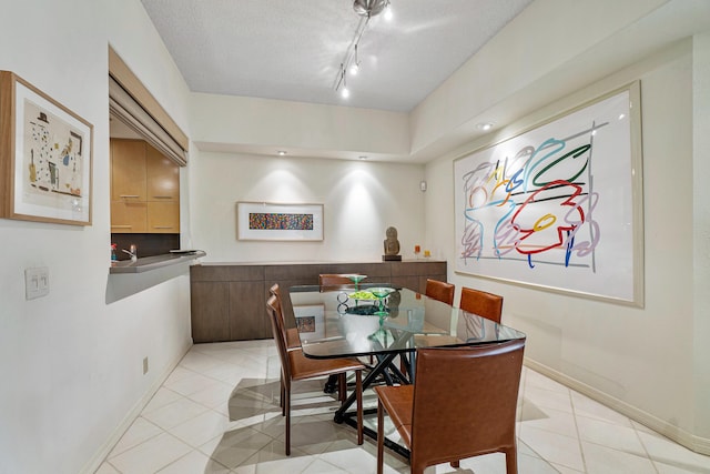 17652 Ashbourne D Way Unit D, Boca Raton, FL 33496 - dining space with light tile patterned floors and baseboards