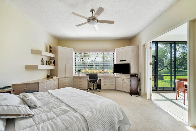17652 Ashbourne D Way Unit D, Boca Raton, FL 33496 - bedroom featuring access to exterior, light colored carpet, multiple windows, and a textured ceiling