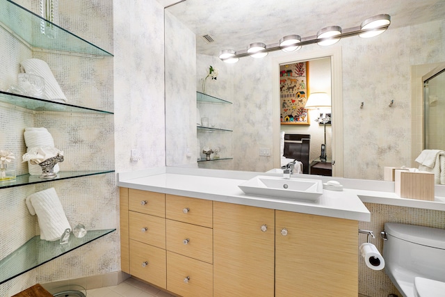 17652 Ashbourne D Way Unit D, Boca Raton, FL 33496 - bathroom with toilet, tile patterned floors, vanity, and an enclosed shower