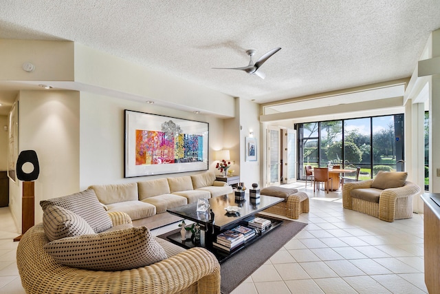 17652 Ashbourne D Way Unit D, Boca Raton, FL 33496 - living area with light tile patterned flooring, a textured ceiling, and a ceiling fan