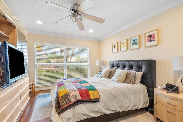 4877 Pineview Cir, Delray Beach, FL 33445 - bedroom with wood finished floors, crown molding, a textured ceiling, ceiling fan, and recessed lighting