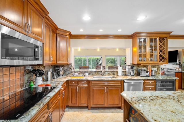4877 Pineview Cir, Delray Beach, FL 33445 - kitchen featuring stainless steel appliances, a sink, beverage cooler, brown cabinets, and recessed lighting
