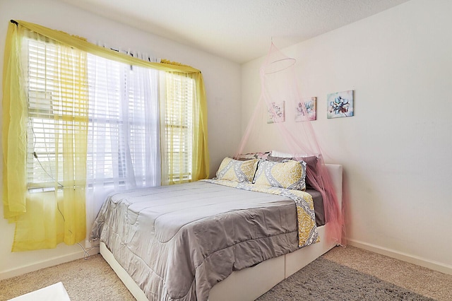 6241 NW Regent St, Port Saint Lucie, FL 34983 - carpeted bedroom featuring baseboards