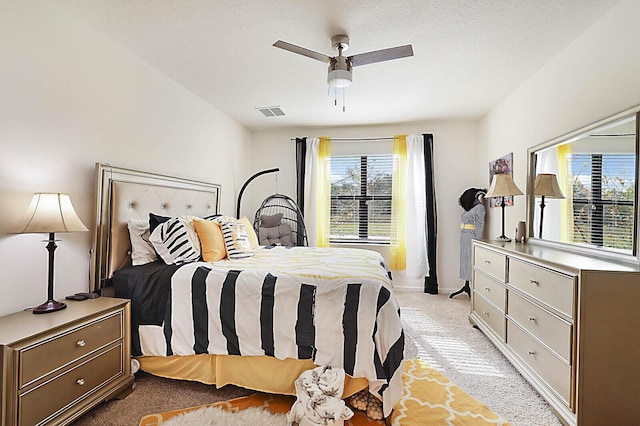 6241 NW Regent St, Port Saint Lucie, FL 34983 - bedroom with light carpet, multiple windows, ceiling fan, and baseboards