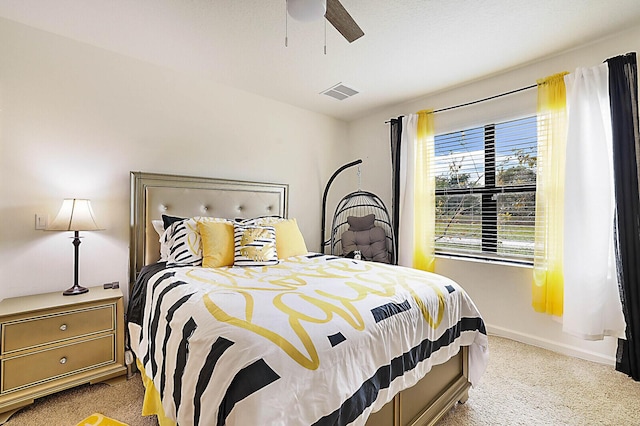 6241 NW Regent St, Port Saint Lucie, FL 34983 - bedroom with carpet, baseboards, and a ceiling fan