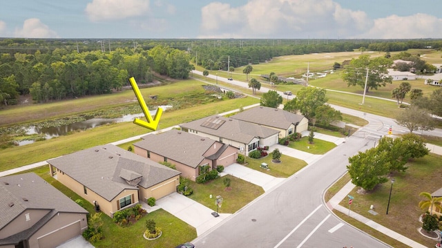 6241 NW Regent St, Port Saint Lucie, FL 34983 - aerial view of residential area with a nearby body of water