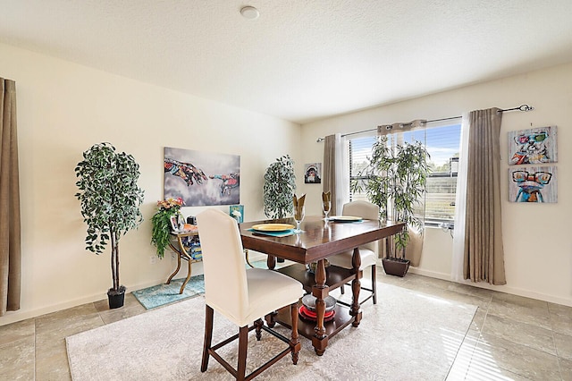6241 NW Regent St, Port Saint Lucie, FL 34983 - dining area with baseboards