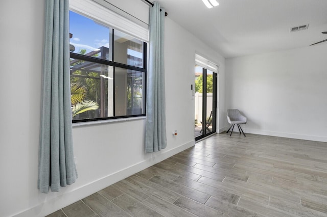 3009 Hop Tree Way, Riviera Beach, FL 33410 - empty room featuring wood finished floors and baseboards