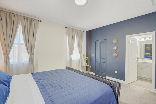 3009 Hop Tree Way, Riviera Beach, FL 33410 - bedroom featuring light colored carpet, ensuite bath, and a closet