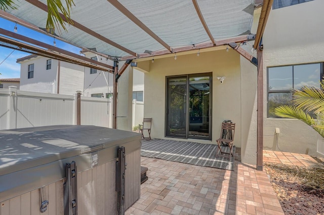 3009 Hop Tree Way, Riviera Beach, FL 33410 - view of patio featuring fence, a hot tub, and a pergola