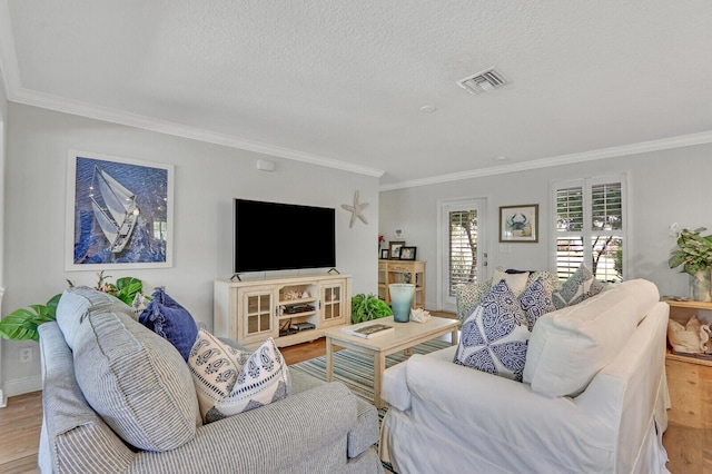 605 Flotilla Ln, North Palm Beach, FL 33408 - living room with ornamental molding, wood finished floors, a textured ceiling, and baseboards