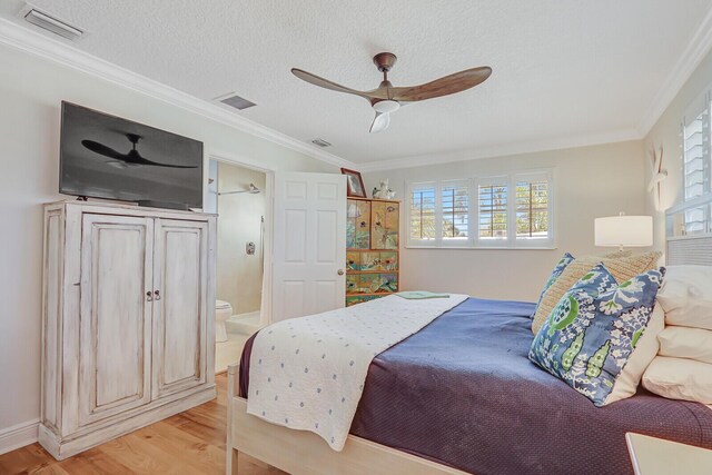 605 Flotilla Ln, North Palm Beach, FL 33408 - bedroom with light wood-style floors, ornamental molding, a ceiling fan, and ensuite bath
