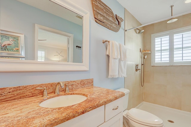 605 Flotilla Ln, North Palm Beach, FL 33408 - full bath featuring a tile shower, vanity, and toilet
