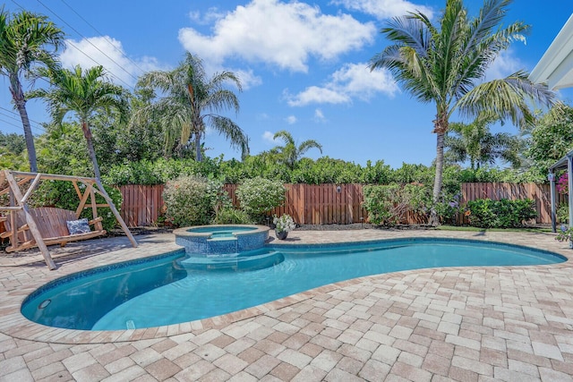 605 Flotilla Ln, North Palm Beach, FL 33408 - view of pool with a fenced backyard, a patio, and a pool with connected hot tub