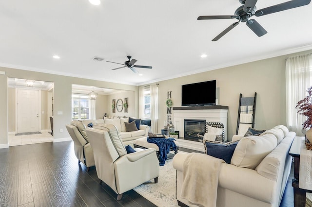 4052 SW Mccandless St, Port Saint Lucie, FL 34953 - living room with ceiling fan, dark wood-style floors, recessed lighting, a glass covered fireplace, and baseboards