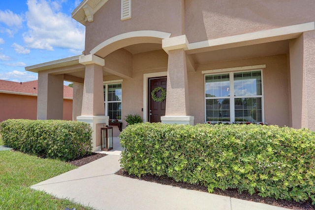4052 SW Mccandless St, Port Saint Lucie, FL 34953 - entrance to property featuring stucco siding