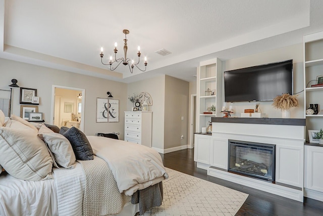 4052 SW Mccandless St, Port Saint Lucie, FL 34953 - bedroom featuring a chandelier, a raised ceiling, and dark wood-type flooring