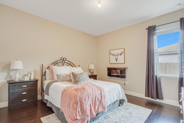 4052 SW Mccandless St, Port Saint Lucie, FL 34953 - bedroom with dark wood-type flooring and baseboards