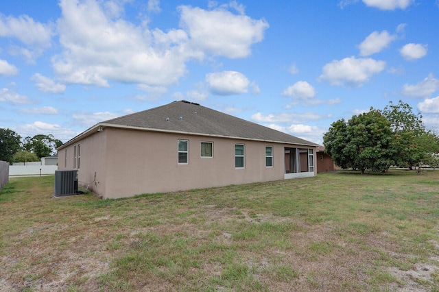 4052 SW Mccandless St, Port Saint Lucie, FL 34953 - rear view of property with central AC unit and stucco siding