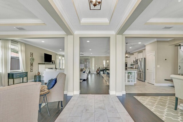 4052 SW Mccandless St, Port Saint Lucie, FL 34953 - foyer entrance featuring light wood-style floors, crown molding, recessed lighting, and baseboards