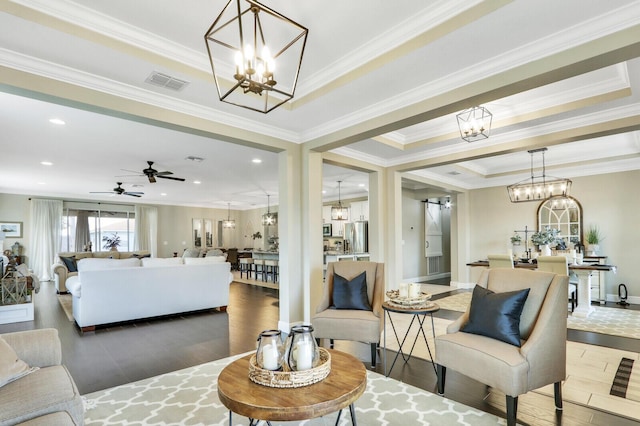 4052 SW Mccandless St, Port Saint Lucie, FL 34953 - living area featuring a chandelier, wood finished floors, ceiling fan, ornamental molding, and recessed lighting