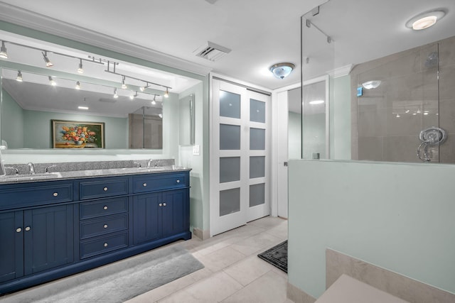 2480 Presidential Way Unit 303, West Palm Beach, FL 33401 - full bath featuring a tile shower, double vanity, rail lighting, and tile patterned flooring